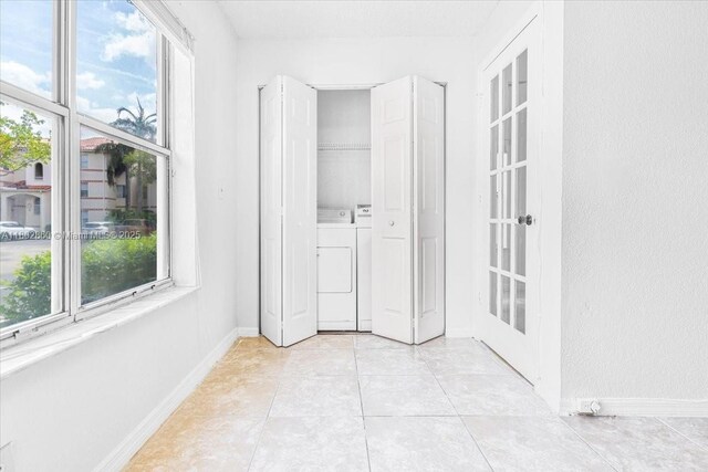 3420 N Pinewalk Dr N Unit 713, Margate, FL 33063 - unfurnished sunroom featuring healthy amount of natural light and washing machine and dryer