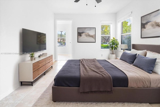 3420 N Pinewalk Dr N Unit 713, Margate, FL 33063 - bedroom with light tile patterned floors, multiple windows, ensuite bathroom, and a ceiling fan