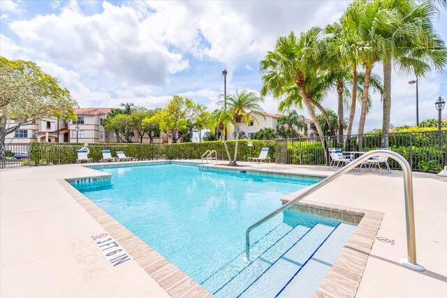 3420 N Pinewalk Dr N Unit 713, Margate, FL 33063 - community pool featuring fence and a patio area
