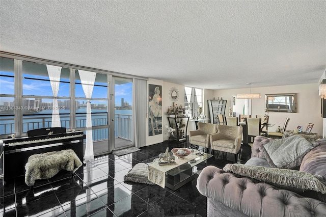301 174th St Unit 1503, Sunny Isles Beach, FL 33160 - living area featuring a water view and a textured ceiling