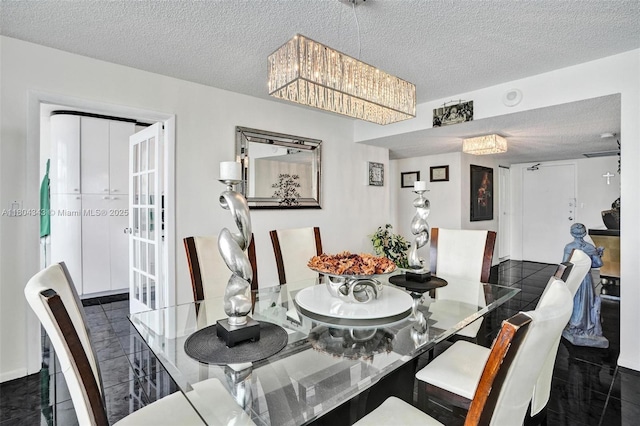 301 174th St Unit 1503, Sunny Isles Beach, FL 33160 - dining room with a textured ceiling, a chandelier, and french doors