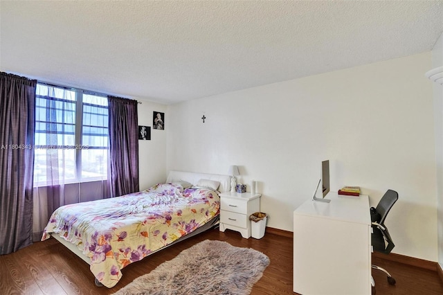 301 174th St Unit 1503, Sunny Isles Beach, FL 33160 - bedroom featuring wood finished floors, baseboards, a desk, and a textured ceiling