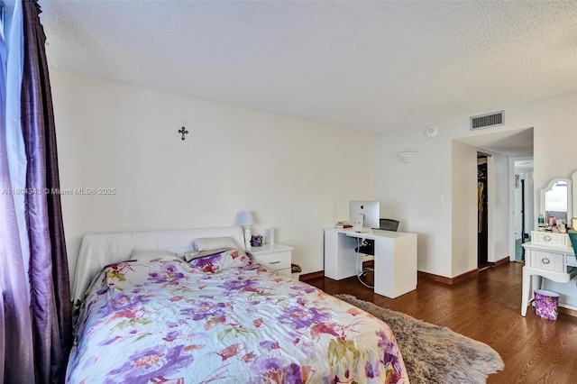 301 174th St Unit 1503, Sunny Isles Beach, FL 33160 - bedroom featuring wood finished floors and a textured ceiling