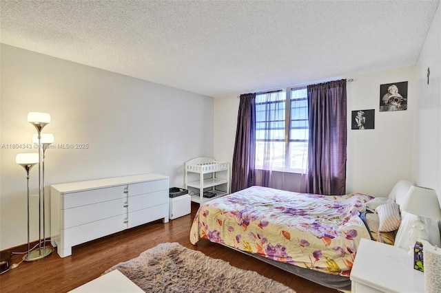 301 174th St Unit 1503, Sunny Isles Beach, FL 33160 - bedroom featuring wood finished floors and a textured ceiling