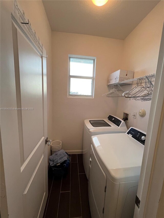27921 SW 134th Ct, Homestead, FL 33032 - washroom with independent washer and dryer and dark tile patterned floors