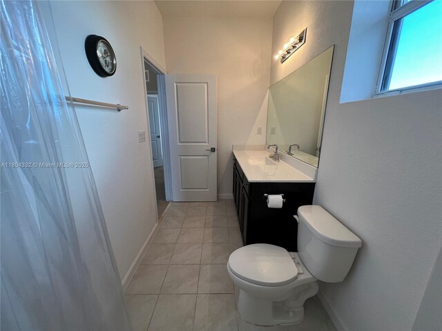 27921 SW 134th Ct, Homestead, FL 33032 - full bath with tile patterned flooring, toilet, vanity, and baseboards