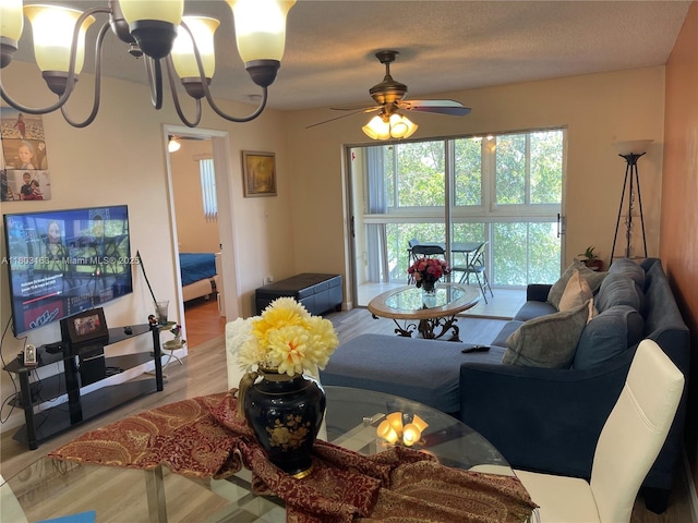 2911 N Pine Island Rd Unit 311, Sunrise, FL 33322 - living room with a chandelier, light wood finished floors, and ceiling fan