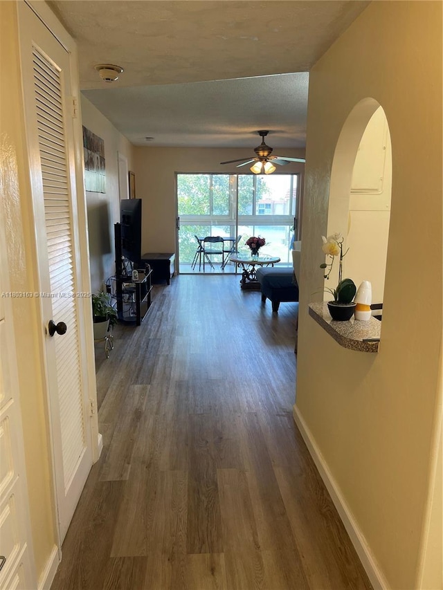 2911 N Pine Island Rd Unit 311, Sunrise, FL 33322 - hall featuring dark wood-style flooring and baseboards