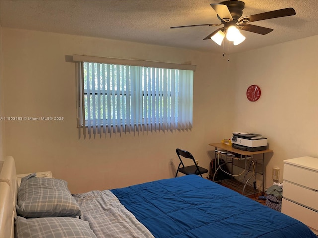 2911 N Pine Island Rd Unit 311, Sunrise, FL 33322 - bedroom featuring multiple windows, a textured ceiling, and ceiling fan