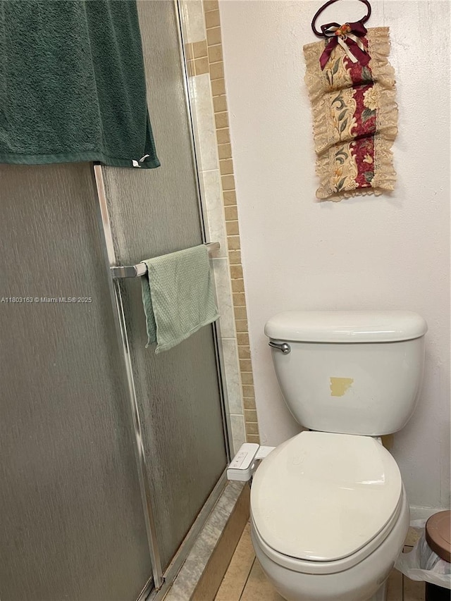2911 N Pine Island Rd Unit 311, Sunrise, FL 33322 - full bathroom with a shower stall, toilet, and tile patterned flooring
