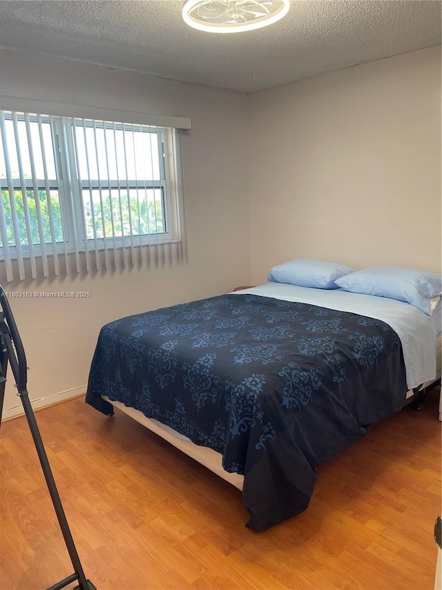 2911 N Pine Island Rd Unit 311, Sunrise, FL 33322 - bedroom with wood finished floors and baseboards