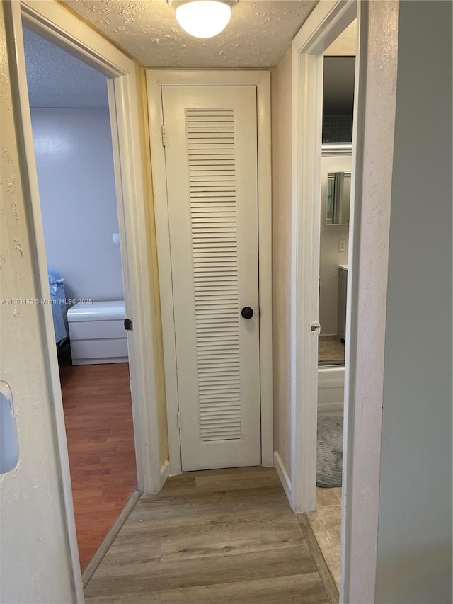 2911 N Pine Island Rd Unit 311, Sunrise, FL 33322 - hallway with light wood-style flooring