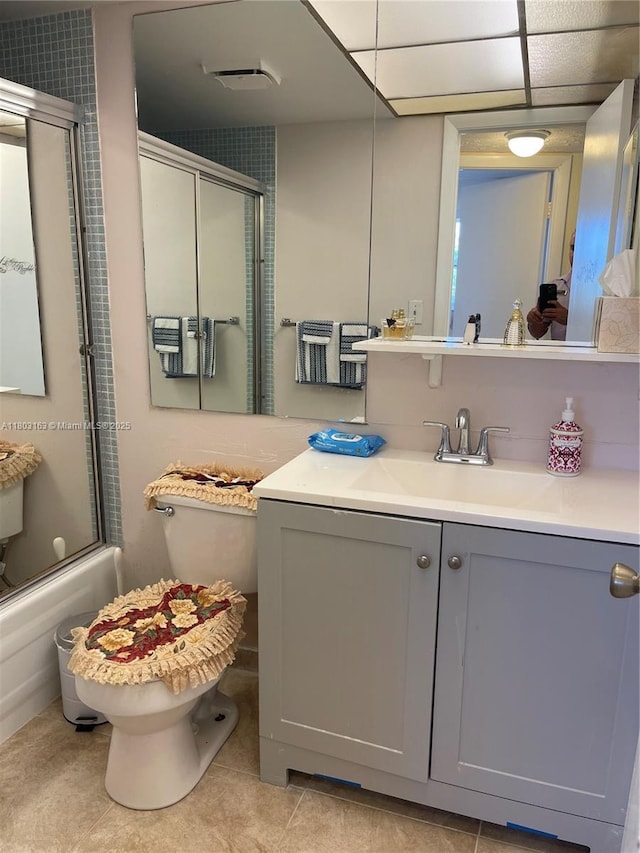 2911 N Pine Island Rd Unit 311, Sunrise, FL 33322 - bathroom featuring combined bath / shower with glass door, toilet, vanity, and tile patterned floors