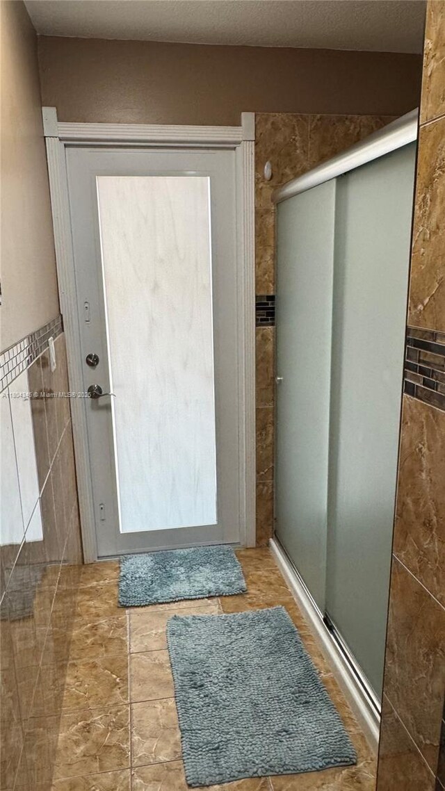 14620 SW 151st Ter, Miami, FL 33186 - doorway to outside featuring tile walls