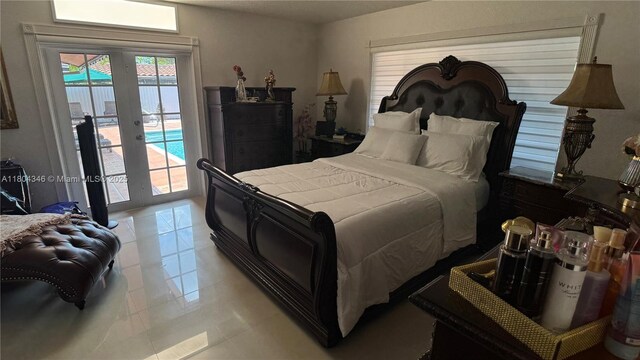 14620 SW 151st Ter, Miami, FL 33186 - bedroom featuring french doors, access to exterior, and light tile patterned flooring
