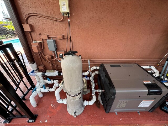 14620 SW 151st Ter, Miami, FL 33186 - exterior view of a textured wall and pump