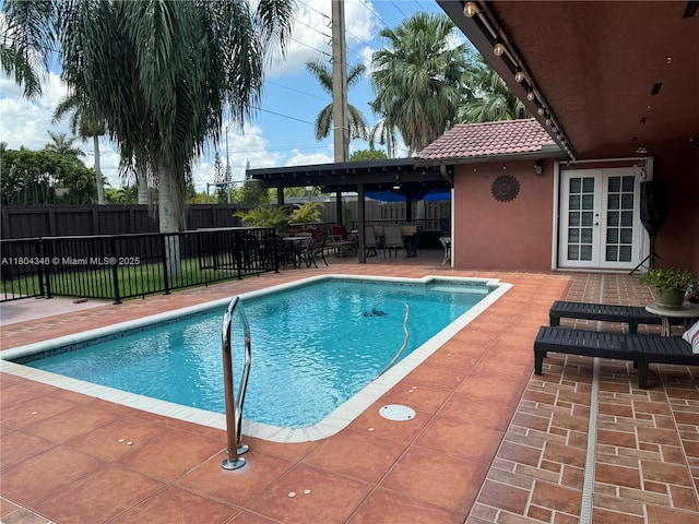 14620 SW 151st Ter, Miami, FL 33186 - view of pool featuring french doors, a fenced backyard, and a patio