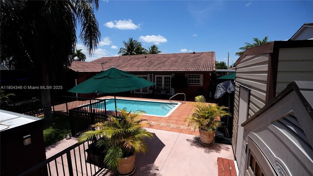 14620 SW 151st Ter, Miami, FL 33186 - view of swimming pool featuring french doors and a patio area