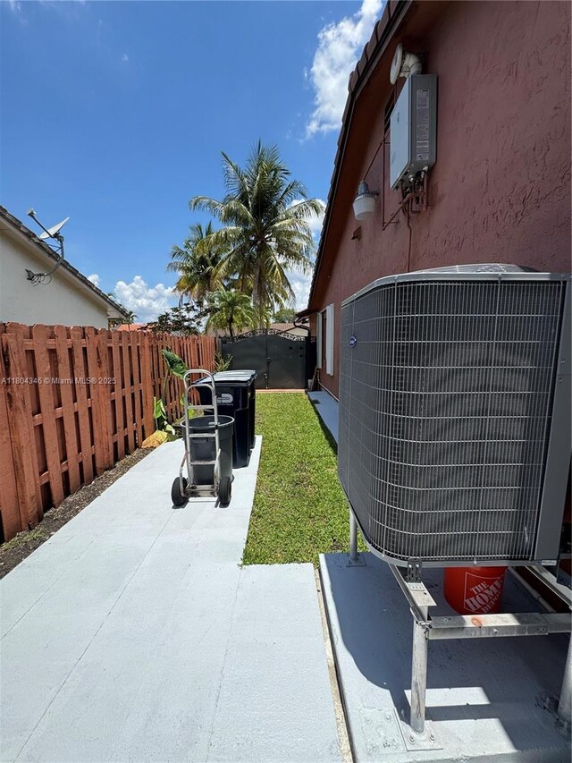 14620 SW 151st Ter, Miami, FL 33186 - fenced backyard featuring central AC and a patio