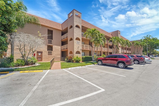 9781 Sunrise Lakes Blvd Unit 202, Sunrise, FL 33322 - view of property featuring uncovered parking