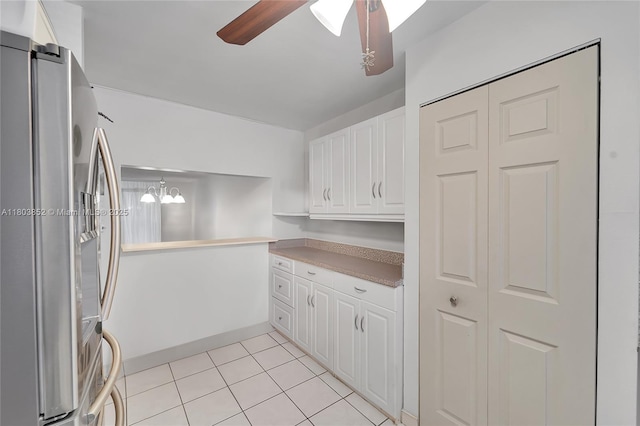 9781 Sunrise Lakes Blvd Unit 202, Sunrise, FL 33322 - kitchen featuring stainless steel refrigerator with ice dispenser, a ceiling fan, white cabinets, and light tile patterned flooring
