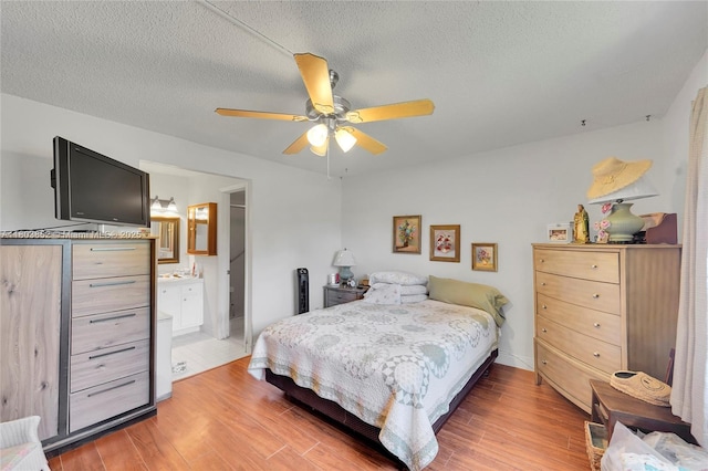 9781 Sunrise Lakes Blvd Unit 202, Sunrise, FL 33322 - bedroom featuring light wood-type flooring, a textured ceiling, and a ceiling fan