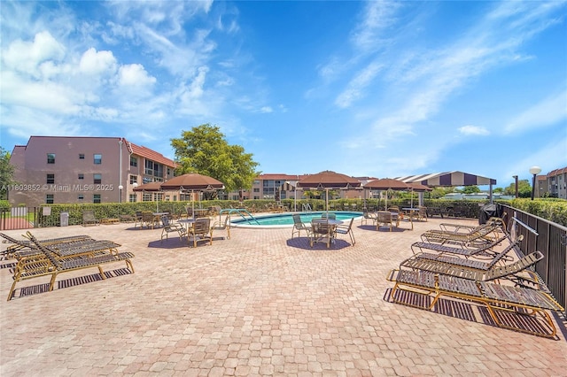 9781 Sunrise Lakes Blvd Unit 202, Sunrise, FL 33322 - community pool featuring a patio area
