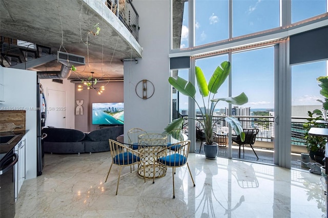 690 SW 1st Ct Unit Phi26, Miami, FL 33130 - dining room with marble tiled flooring, a towering ceiling, and expansive windows