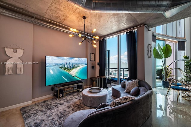 690 SW 1st Ct Unit Phi26, Miami, FL 33130 - living area featuring a chandelier and baseboards