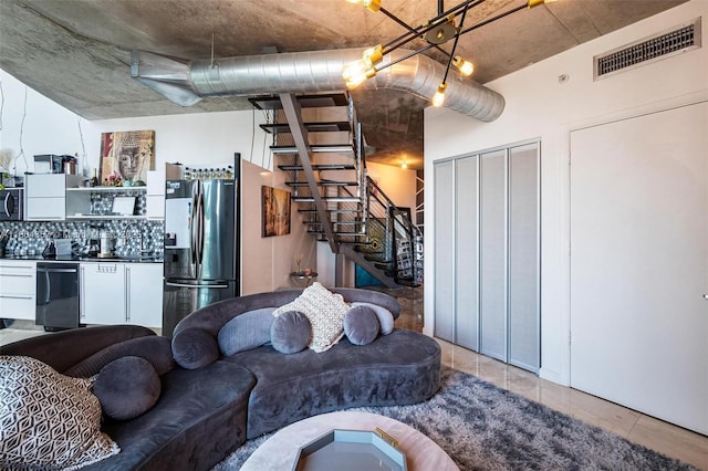 690 SW 1st Ct Unit Phi26, Miami, FL 33130 - living room with bar, stairway, and tile patterned flooring
