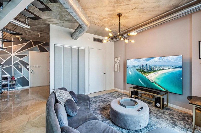 690 SW 1st Ct Unit Phi26, Miami, FL 33130 - living area featuring a chandelier and baseboards