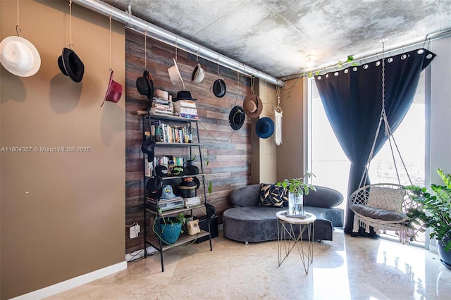 690 SW 1st Ct Unit Phi26, Miami, FL 33130 - sitting room featuring wooden walls and baseboards