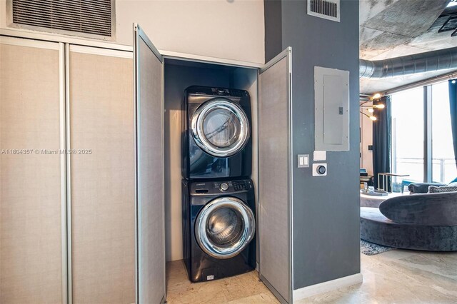 690 SW 1st Ct Unit Phi26, Miami, FL 33130 - clothes washing area with stacked washer and clothes dryer and electric panel