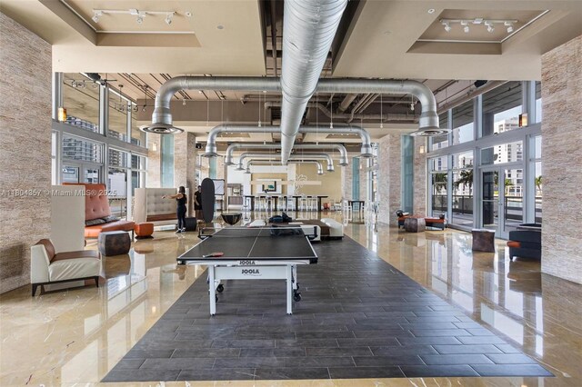 690 SW 1st Ct Unit Phi26, Miami, FL 33130 - playroom featuring a high ceiling and plenty of natural light