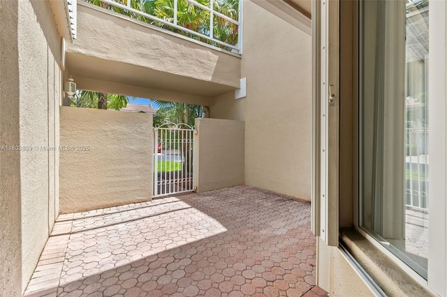 view of patio featuring a gate