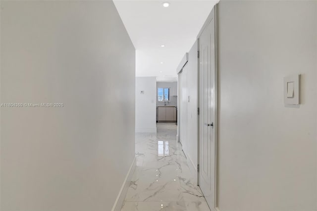 2807 NE 164th St Unit 2, North Miami Beach, FL 33160 - corridor featuring light marble finish floors, baseboards, and recessed lighting