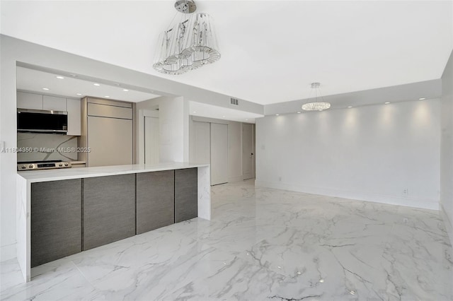2807 NE 164th St Unit 2, North Miami Beach, FL 33160 - kitchen with appliances with stainless steel finishes, modern cabinets, light marble finish floors, recessed lighting, and light countertops