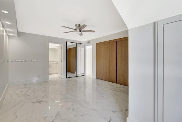 2807 NE 164th St Unit 2, North Miami Beach, FL 33160 - unfurnished bedroom featuring light marble finish flooring, recessed lighting, baseboards, ceiling fan, and ensuite bath