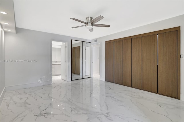 2807 NE 164th St Unit 2, North Miami Beach, FL 33160 - unfurnished bedroom featuring light marble finish floors, baseboards, recessed lighting, a ceiling fan, and ensuite bath