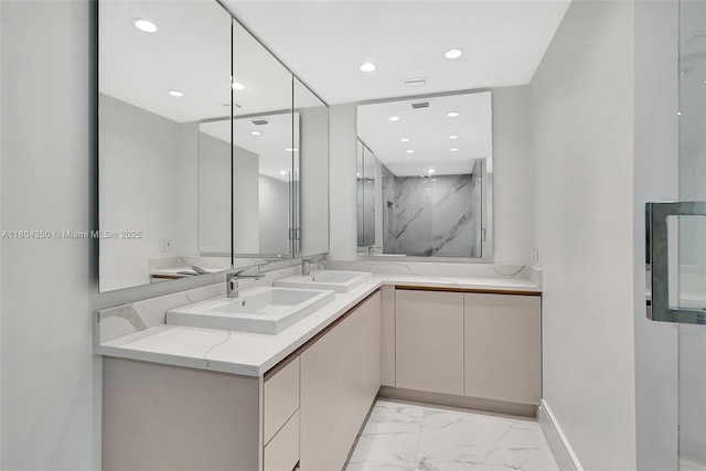 2807 NE 164th St Unit 2, North Miami Beach, FL 33160 - bathroom with marble look tile flooring, a marble finish shower, double vanity, recessed lighting, and baseboards