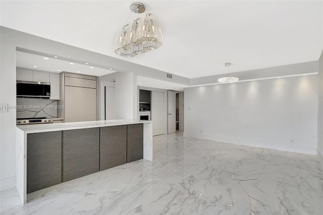 2807 NE 164th St Unit 2, North Miami Beach, FL 33160 - kitchen with modern cabinets, a chandelier, light marble finish floors, light countertops, and gray cabinetry