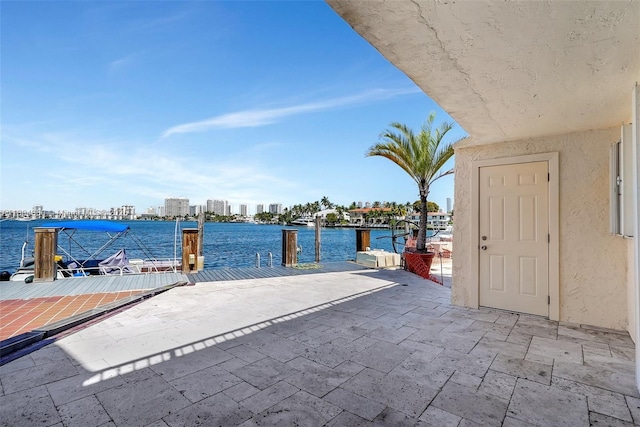 2807 NE 164th St Unit 2, North Miami Beach, FL 33160 - view of patio / terrace featuring a boat dock and a water view