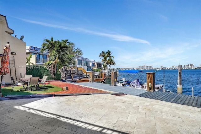 2807 NE 164th St Unit 2, North Miami Beach, FL 33160 - view of patio / terrace with a dock and a water view