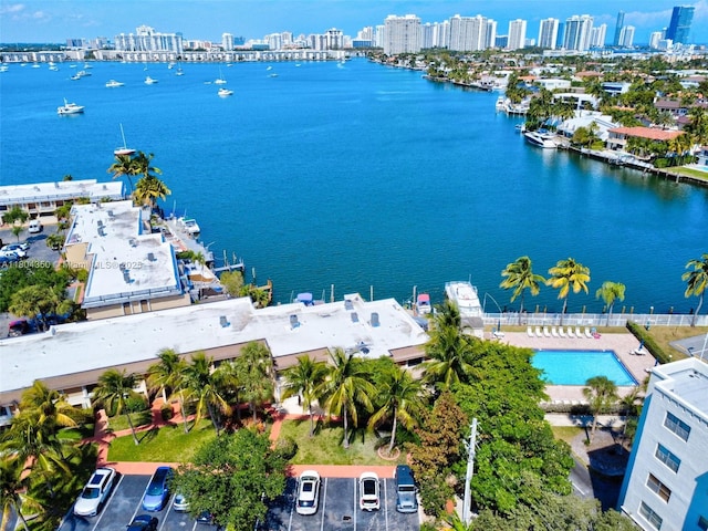 2807 NE 164th St Unit 2, North Miami Beach, FL 33160 - drone / aerial view of city skyline, a nearby body of water, and a pool