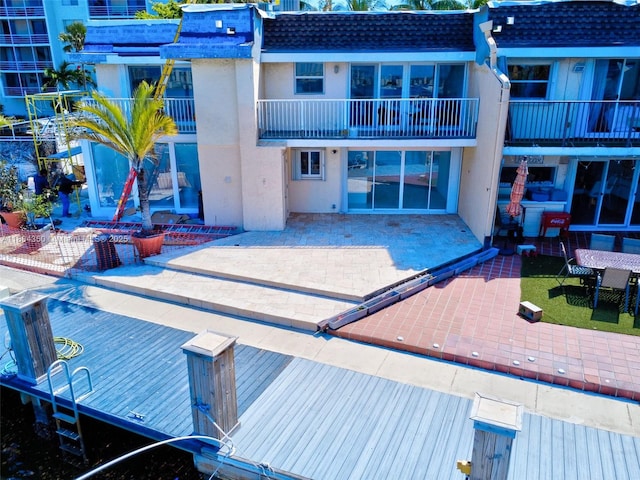 2807 NE 164th St Unit 2, North Miami Beach, FL 33160 - back of property featuring a patio area and stucco siding