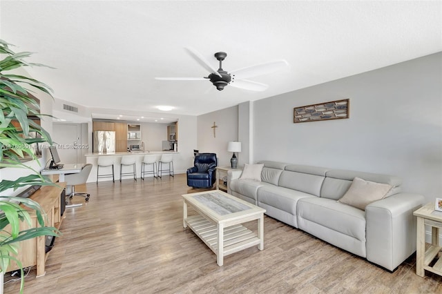 800 SE 20th Ave Unit 303, Deerfield Beach, FL 33441 - living room featuring light wood-type flooring and ceiling fan