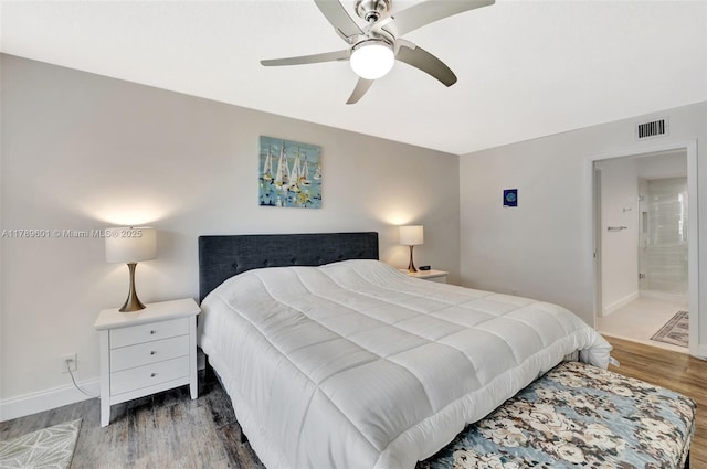 800 SE 20th Ave Unit 303, Deerfield Beach, FL 33441 - bedroom with wood finished floors, baseboards, and ceiling fan