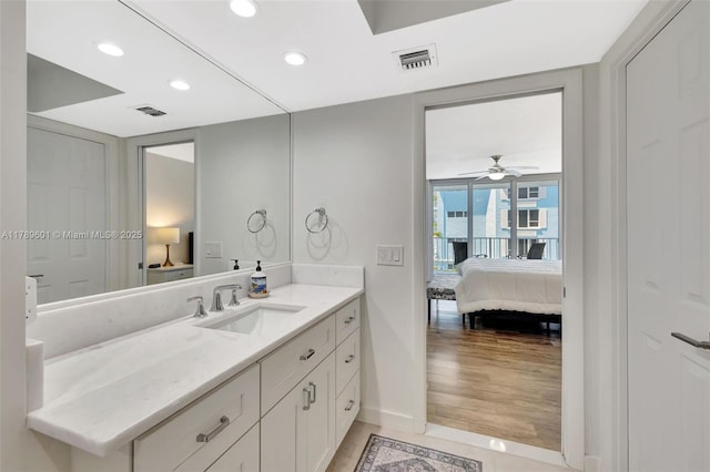 800 SE 20th Ave Unit 303, Deerfield Beach, FL 33441 - bathroom featuring connected bathroom, baseboards, vanity, recessed lighting, and ceiling fan