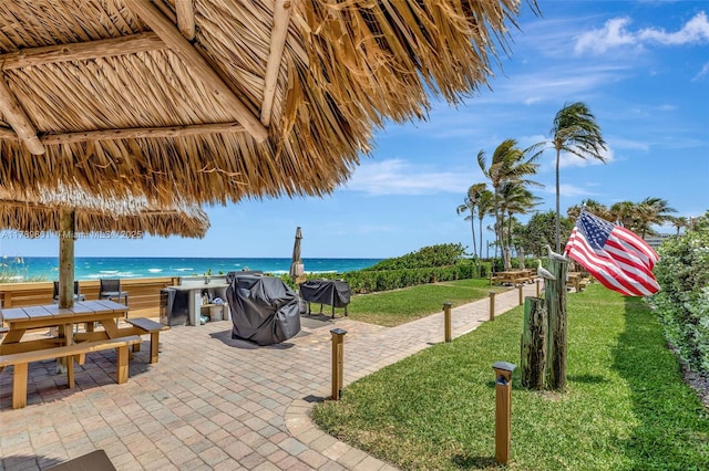 800 SE 20th Ave Unit 303, Deerfield Beach, FL 33441 - view of patio with a water view and area for grilling