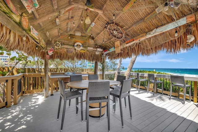800 SE 20th Ave Unit 303, Deerfield Beach, FL 33441 - deck featuring ceiling fan, a gazebo, view of water and beach, and outdoor dining area